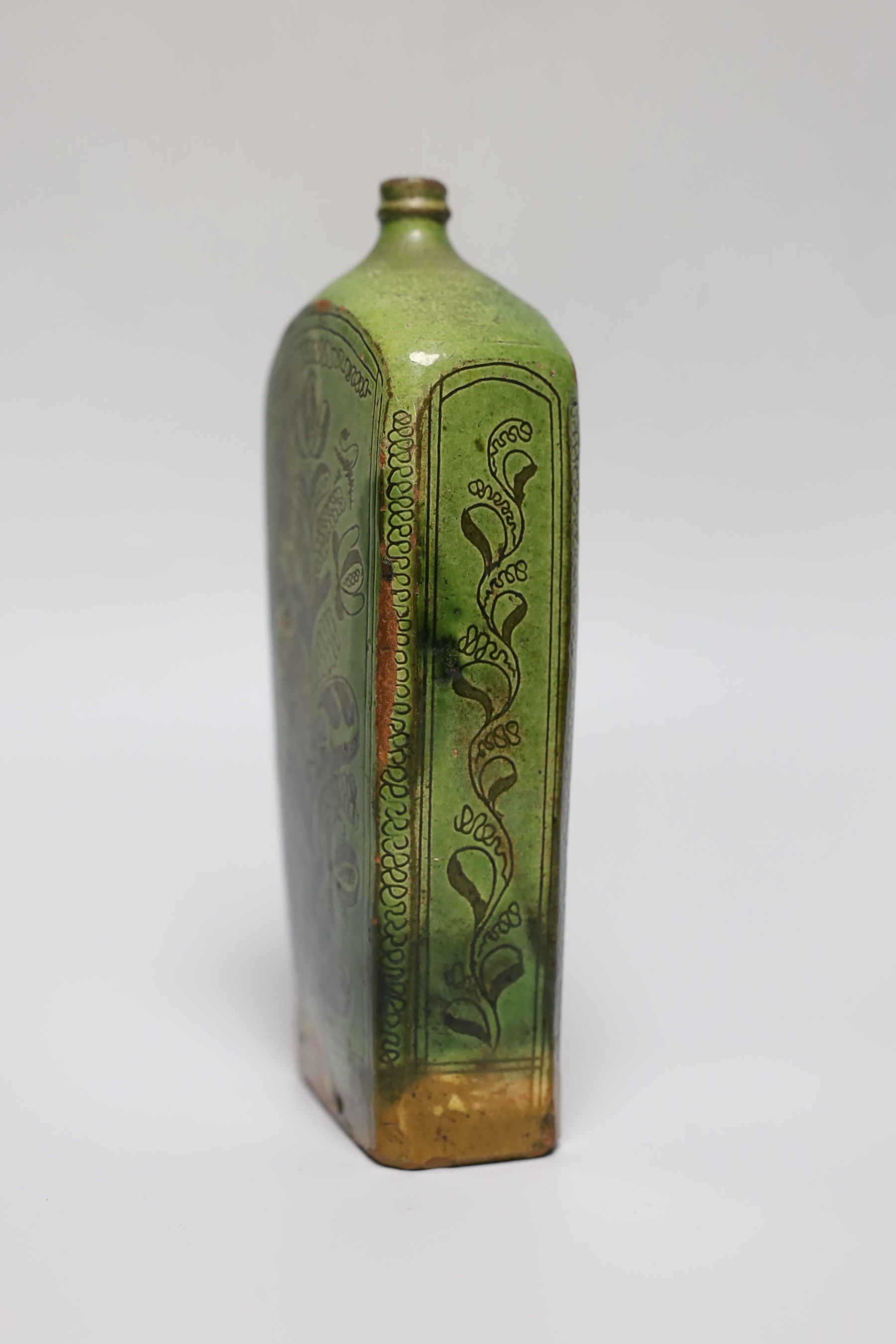 A 19th century green glazed terracotta Sgraffito flask, 19cm